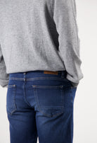 Sustainable MUD Jeans in light blue denim, paired with matching denim jacket, showcasing ethical fashion in classic fit.