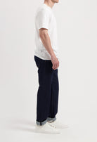 Sustainable MUD Jeans and denim jacket set, crafted from organic cotton, showcasing a classic blue wash and ethical design.
