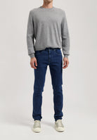 Sustainable MUD Jeans in dark blue denim, crafted ethically from organic cotton, featuring classic design and fit.