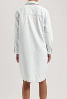 Back view of a light blue denim shirt dress showing a relaxed fit with long sleeves and classic collar design.
