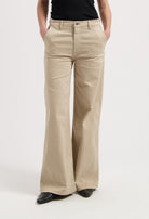 Wide-leg khaki pants shown being worn with a black top, showcasing a comfortable and stylish high-waisted design.